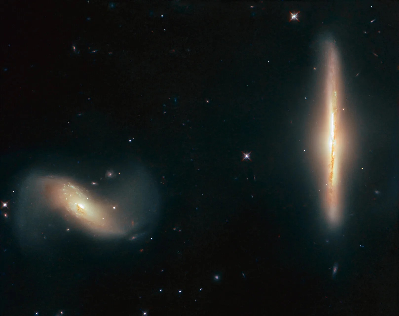 Hubble image of ngc 6285 (left) and ngc 6286 (right)