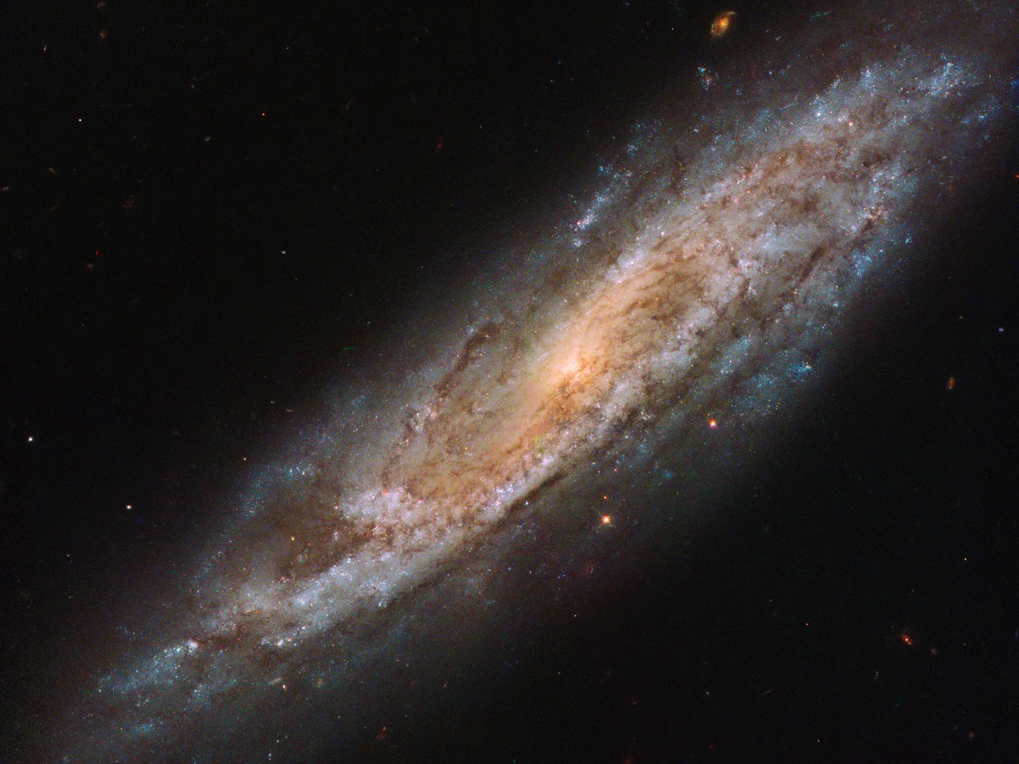 Bright spiral galaxy, seen at an angle.