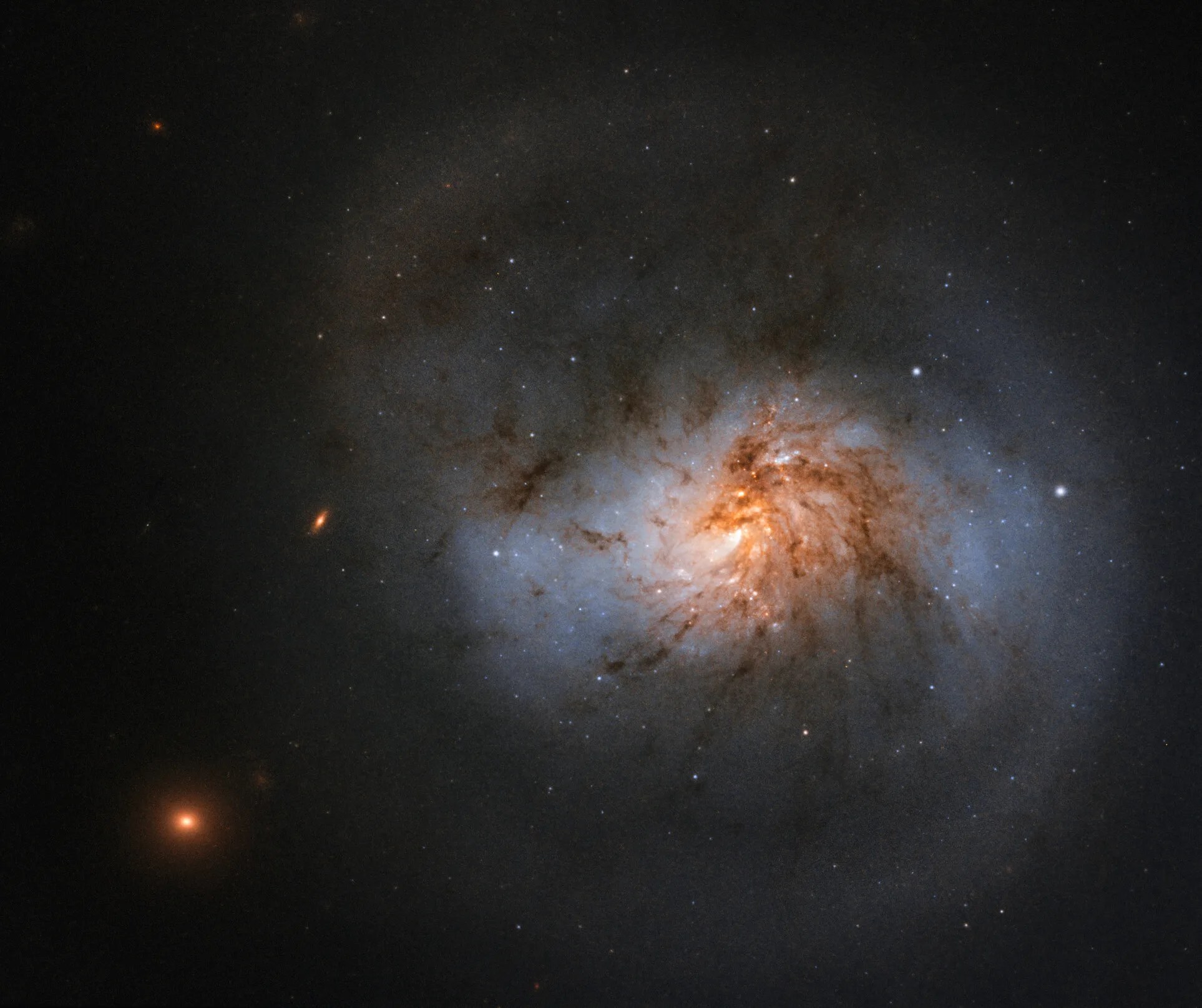Swirled galaxy with bright center against dark backdrop of space