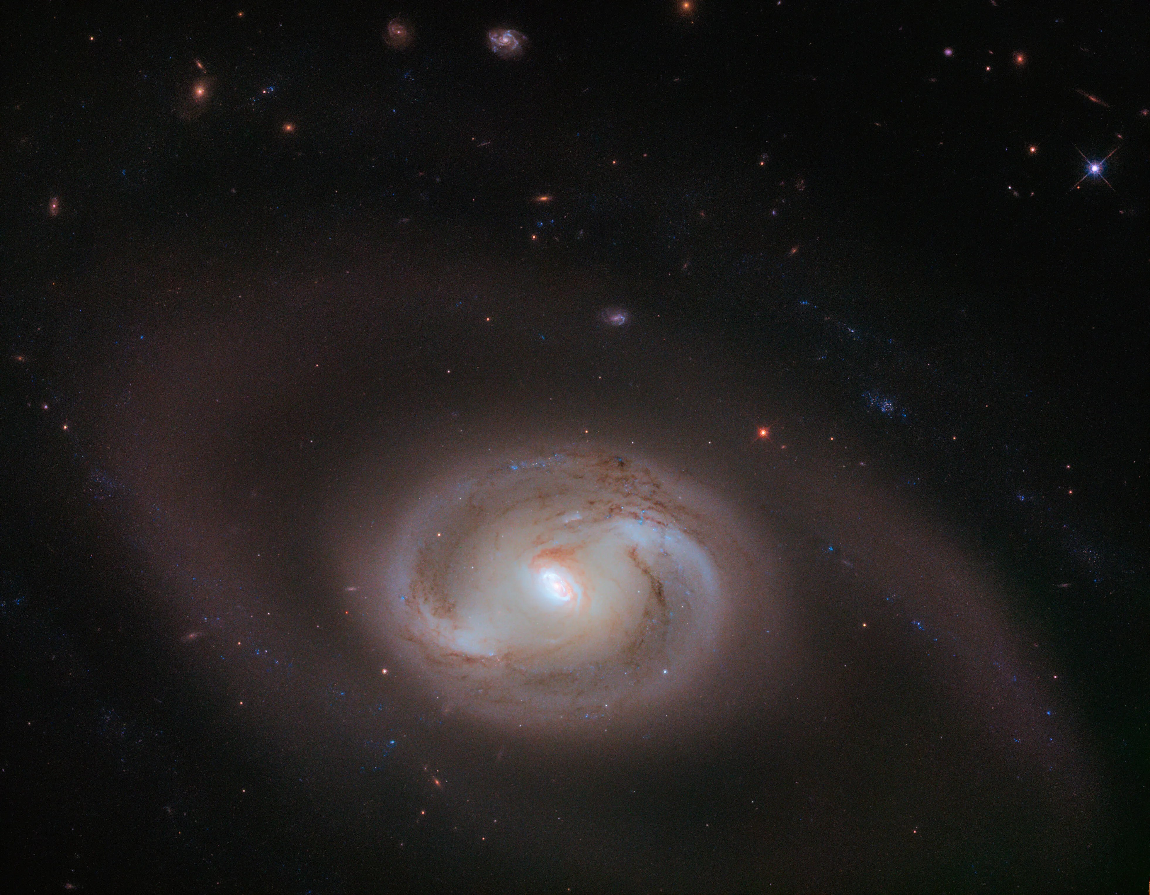 Hubble image of ngc 2273: bright spiral shapes against black backdrop of space