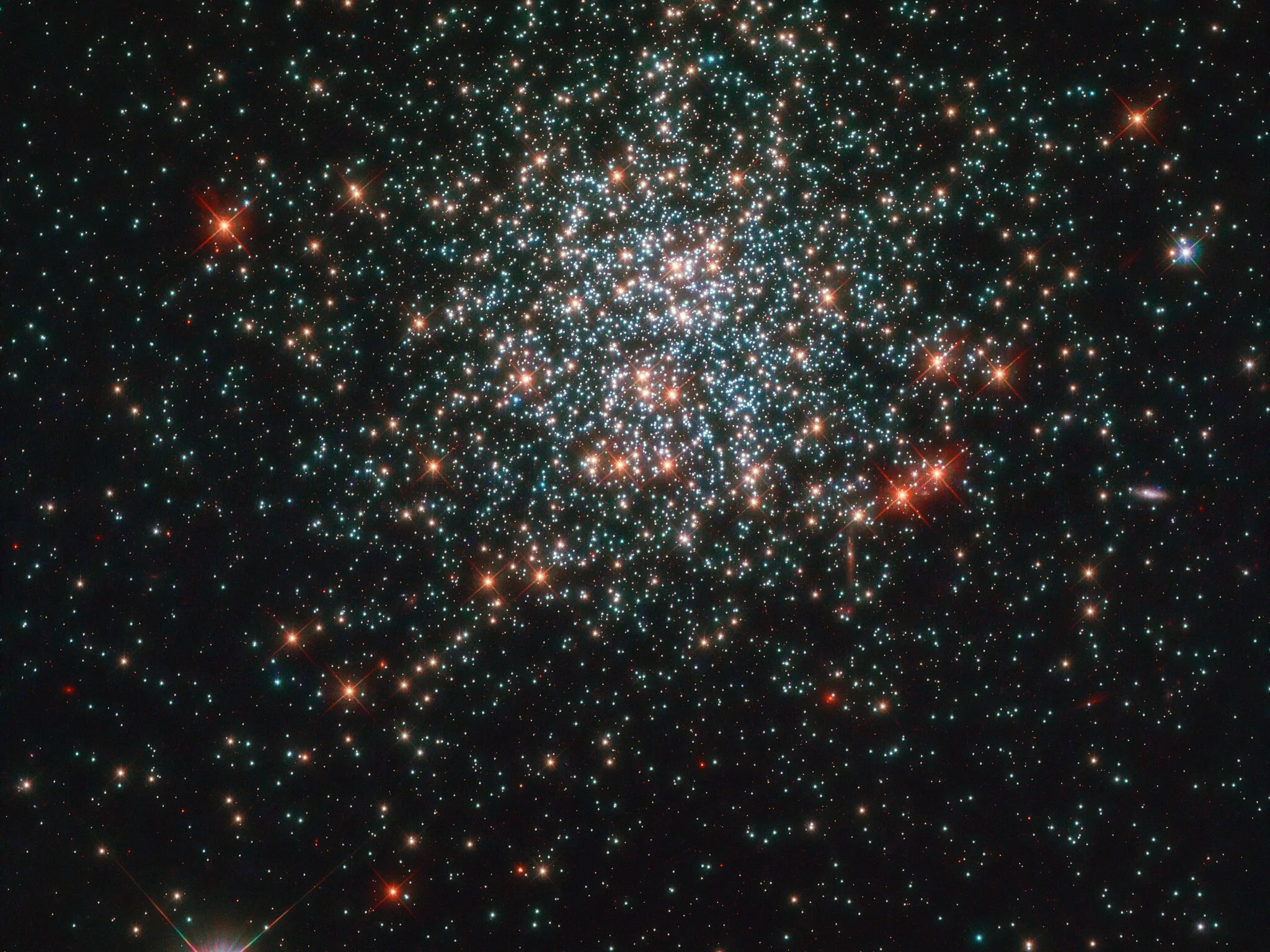 Bright specks of star cluster ngc 2203 against black backdrop of space
