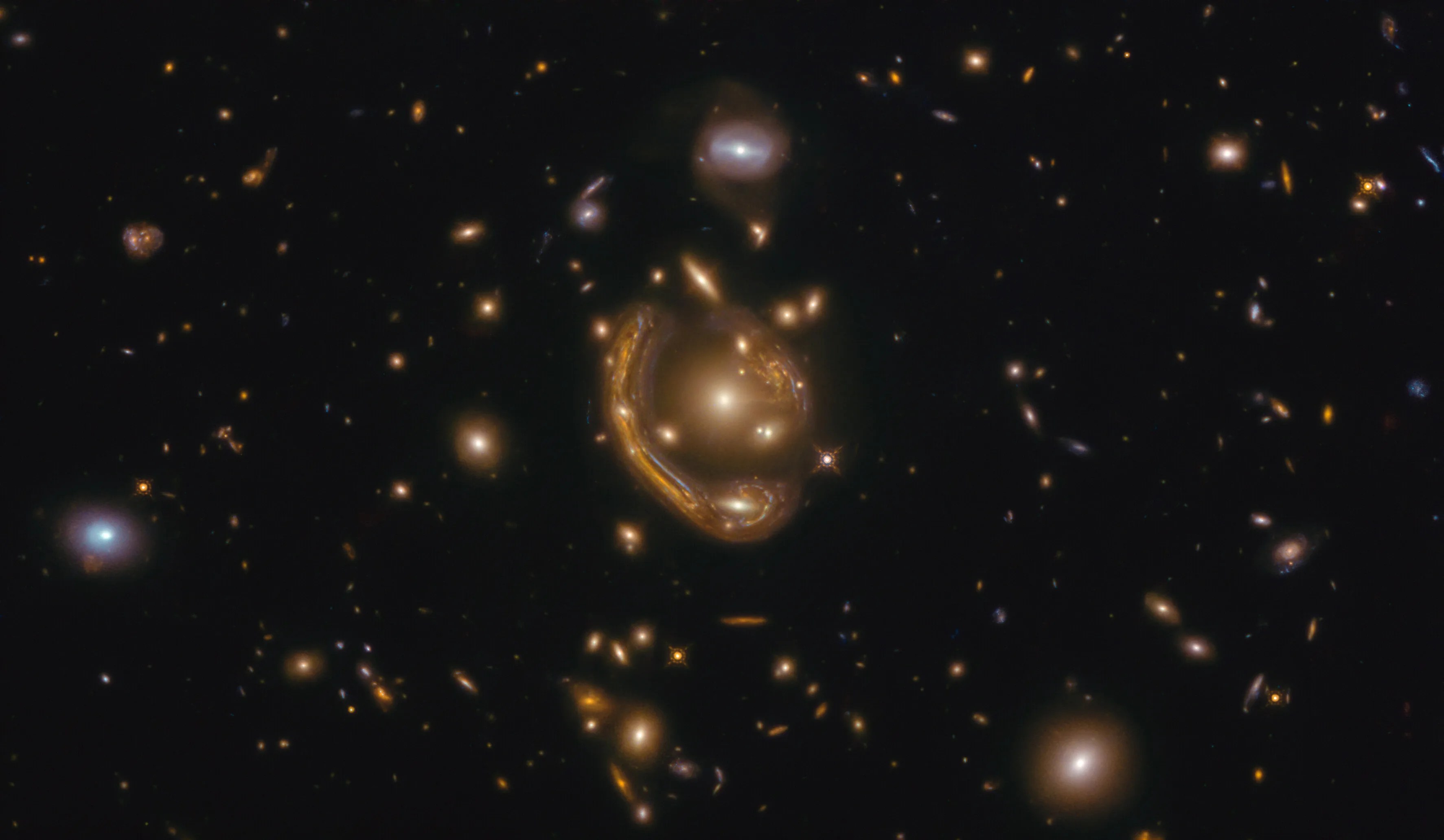 This image, taken with the nasa/esa hubble space telescope, depicts gal-clus-022058s.