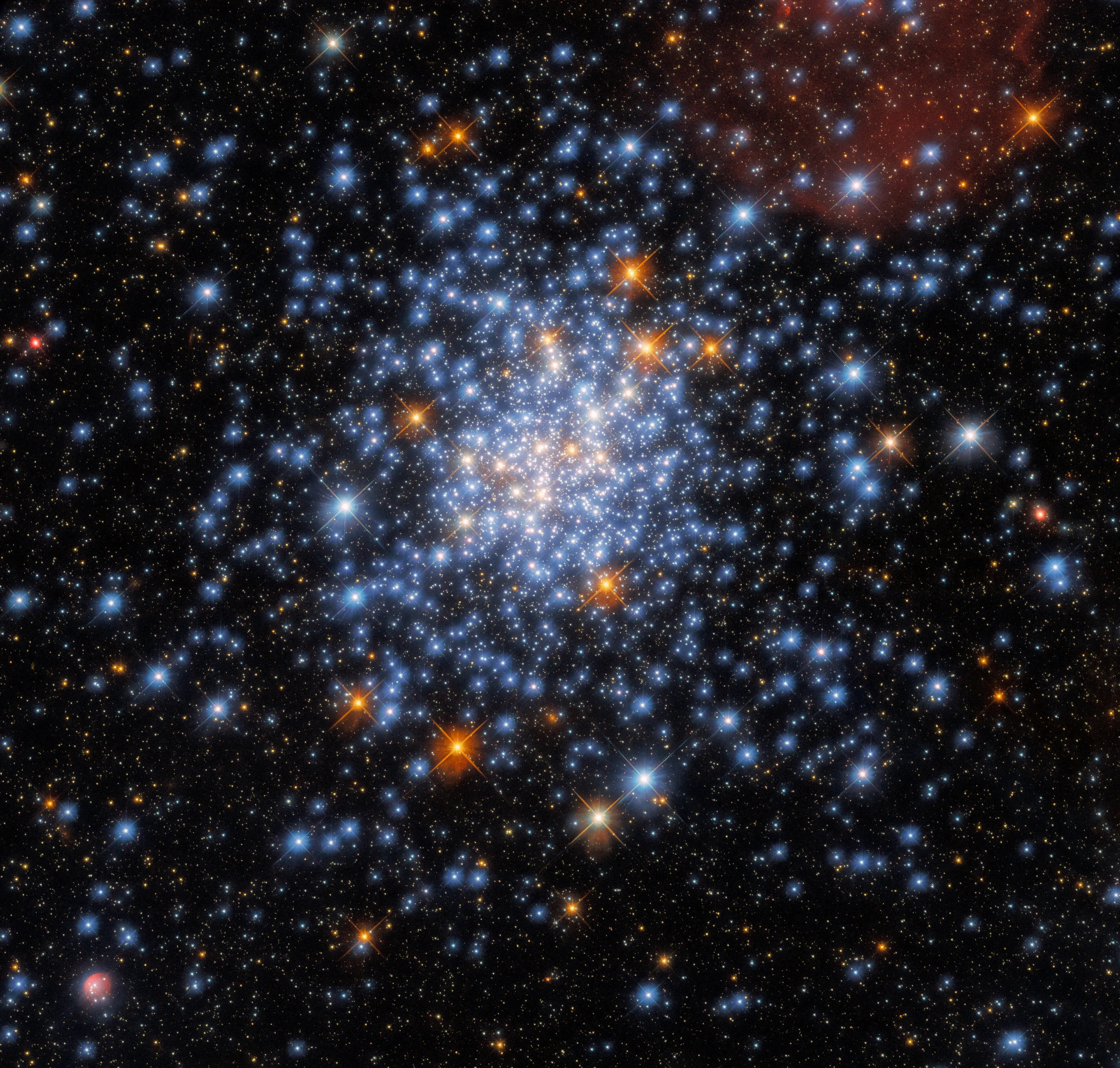 This image taken with the nasa/esa hubble space telescope depicts the open star cluster ngc 330, which lies around 180,000 light-years away inside the small magellanic cloud.