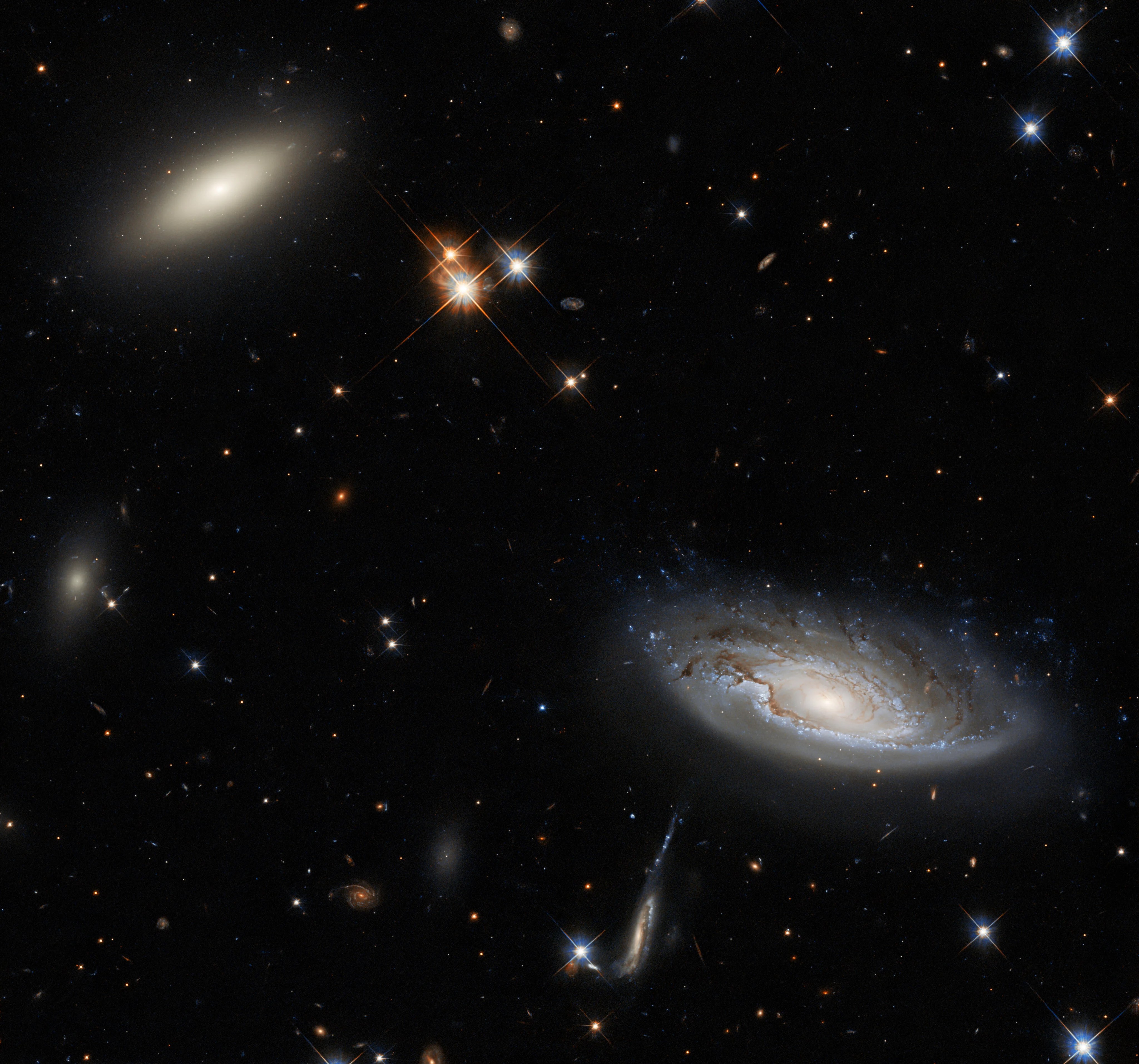 Two enormous galaxies capture your attention in this spectacular image taken with the nasa/esa hubble space telescope using the wide field camera 3 (wfc3).