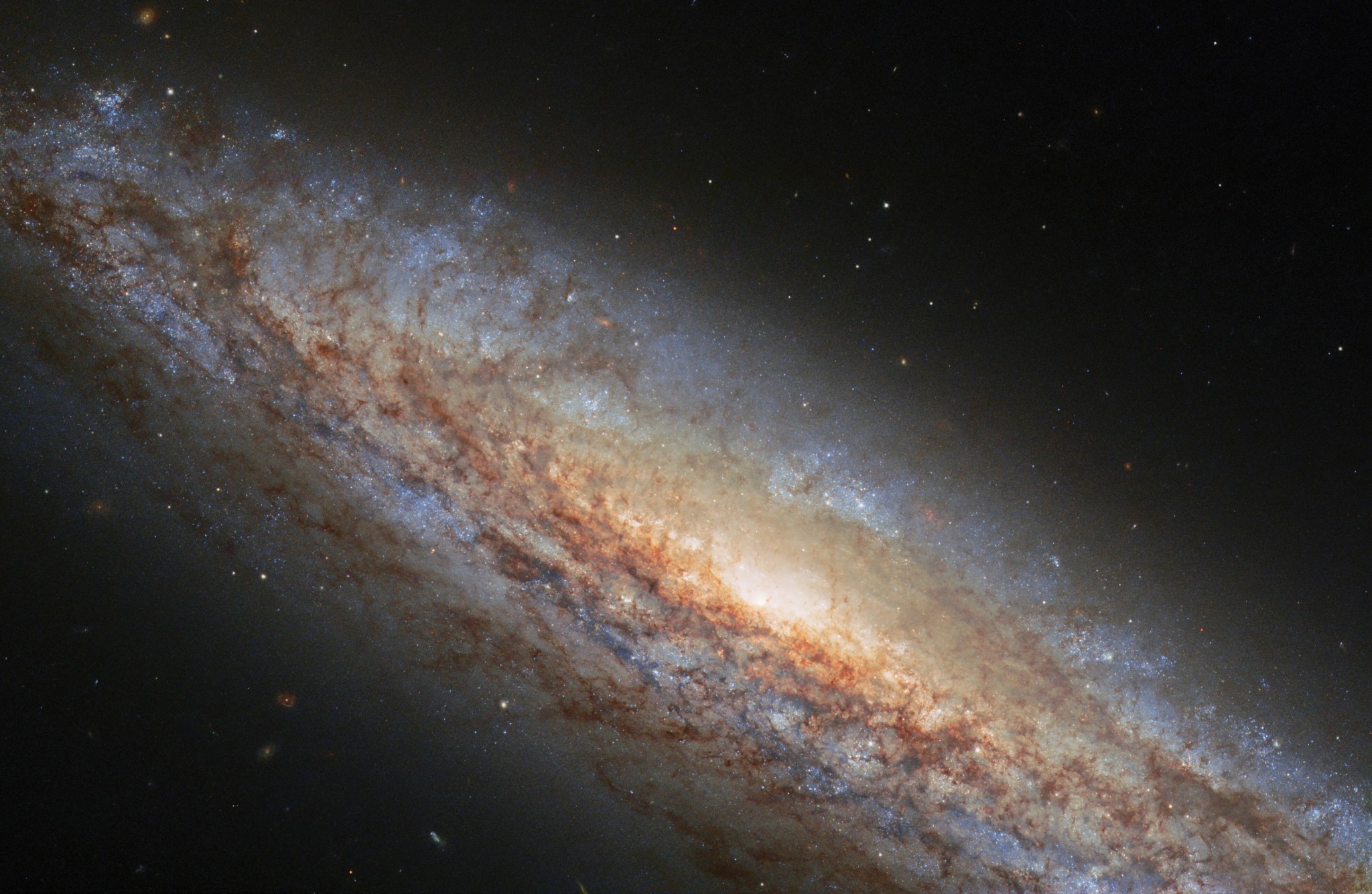 Ngc 4666, a spiral galaxy, takes center stage in this image from the nasa/esa hubble space telescope.