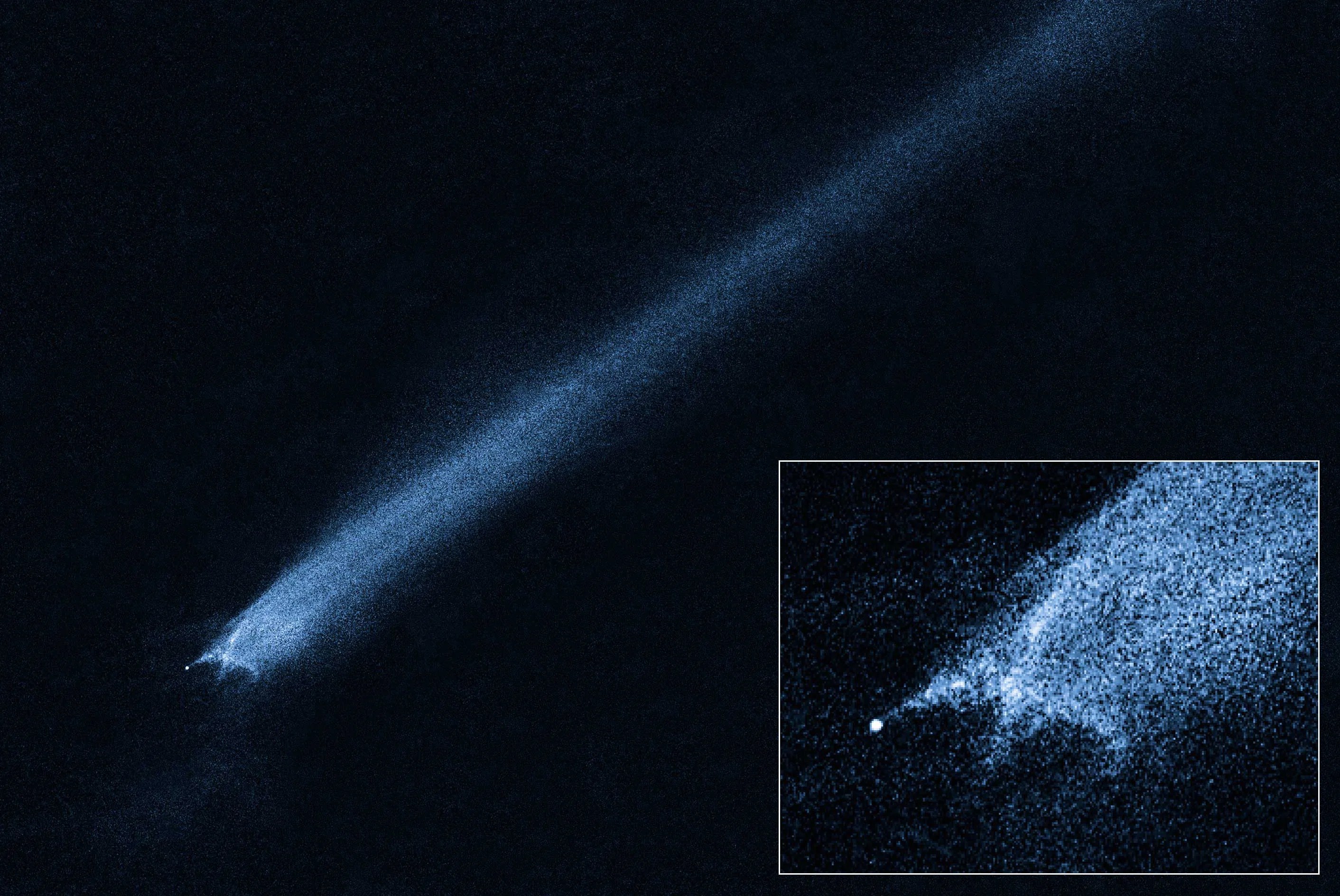 Hubble observations of possible asteroid collision remnants. Streak of blue-white light that begins at lower-left with an X-shape, and extends with a long tail to the upper right. Lower right holds a close-up of the "X."