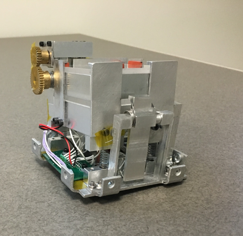 Photo of the Q-Pace test chamber, a small grey metal box with electronics.
