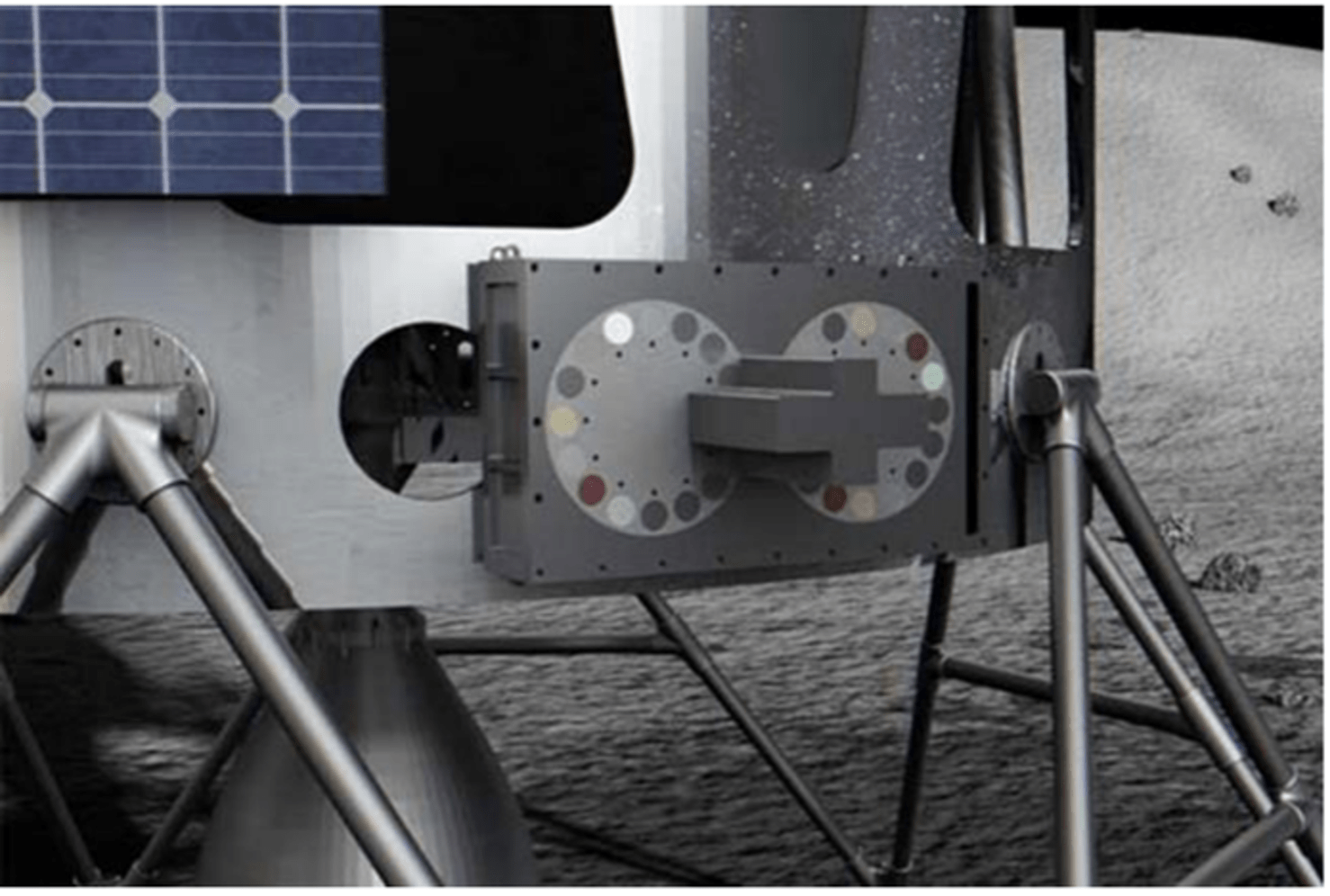 A graphic image of the device is attached to the outside of a lander. Only the bottom corner of the lander is shown to focus on the mounted device. The rectangular, grey instrument shows its two identical sample wheels side by side with samples varying in color.