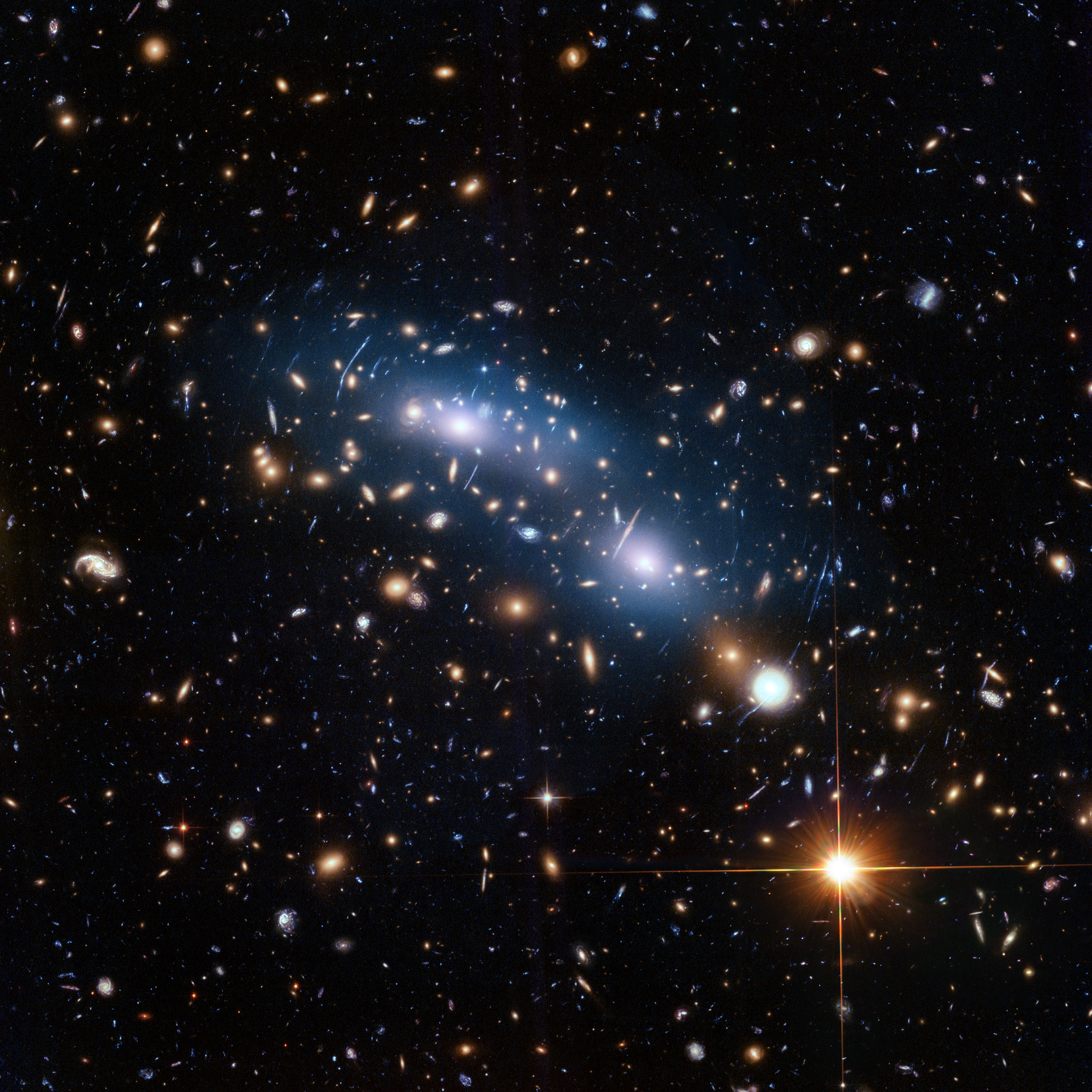 smaller cluster of galaxies bathed in blue