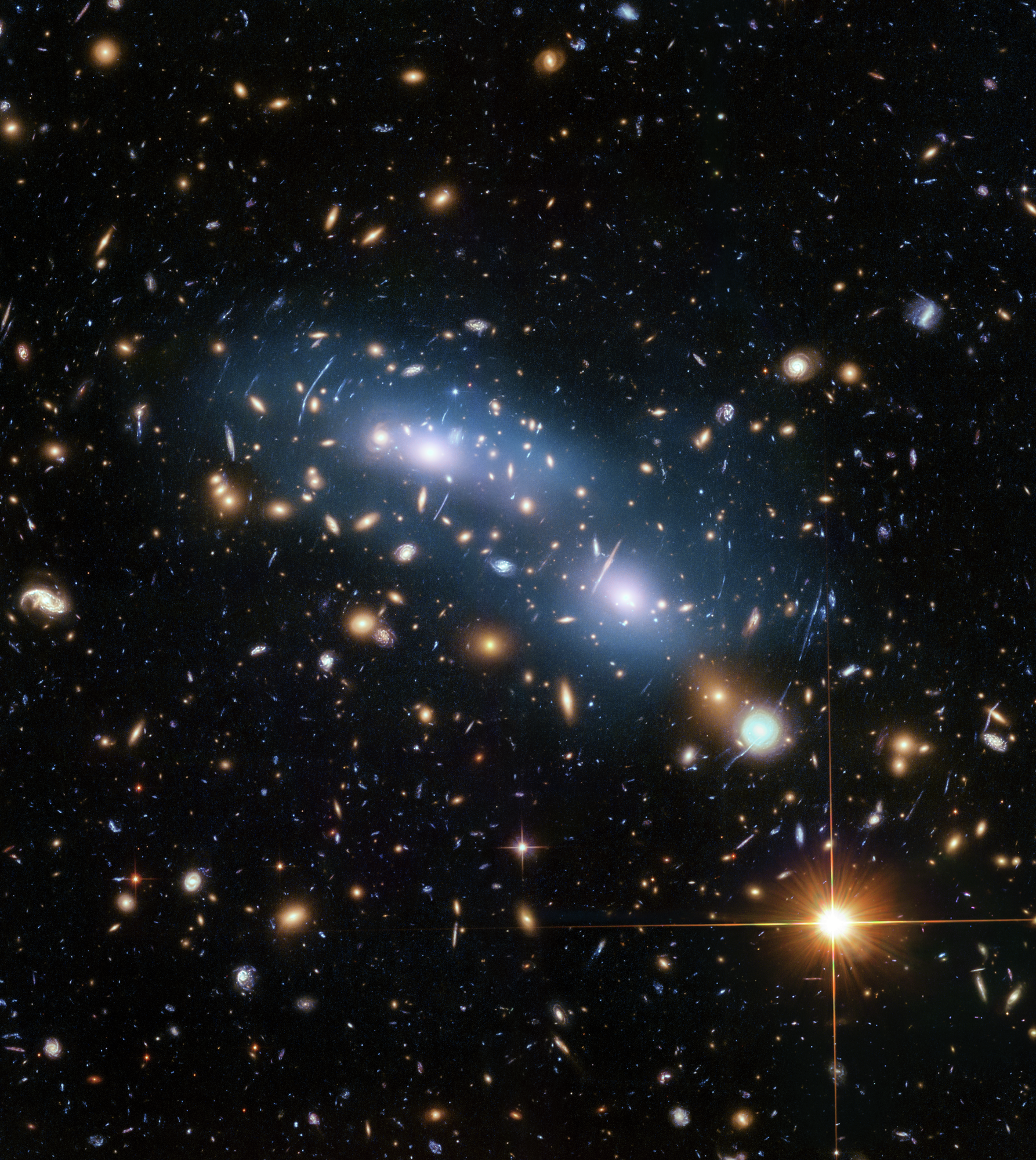 Hubble image of galaxy cluster MACS J0416 showing a starry sky scene with central blue smear