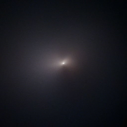 fuzzy white view of NEOWISE comet against black backdrop of space