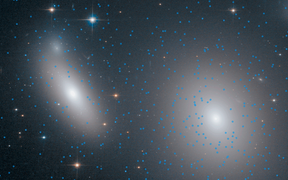 animation showing red and blue annotations on two galaxies