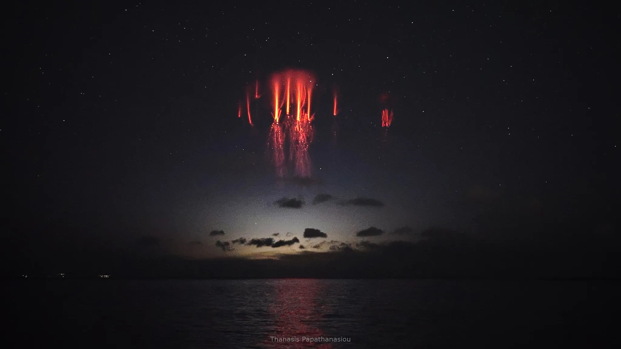 Red sprites formed above thunderstorms in the southeast Aegean Sea, as captured from the eastern suburbs of Athens, Greece on December 4, 2021.