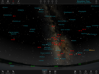 A map of the sky on a computer screen, with the horizon at the bottom and some of the Milky Way in the center, with multiple object names on the image. Controls are at the bottom of the screen.