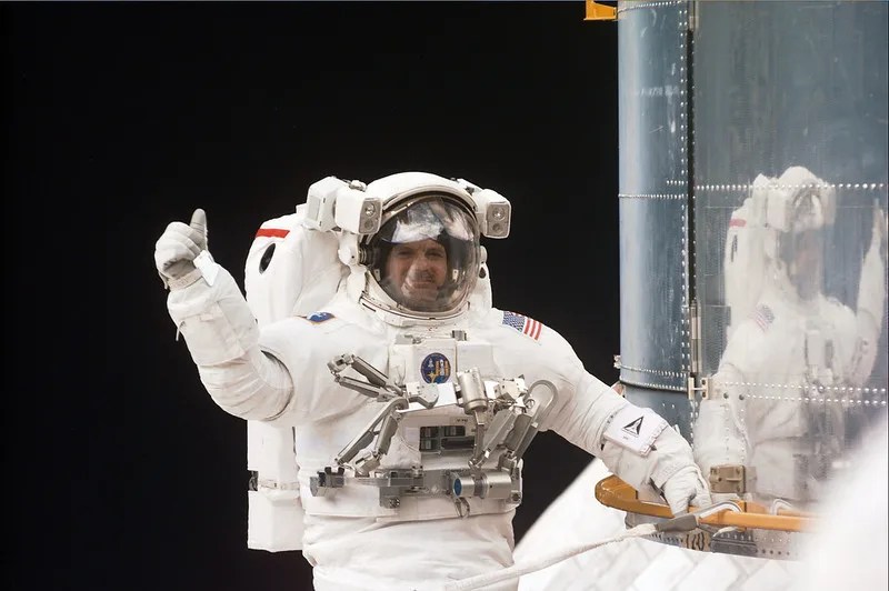 Seventeen astronauts have taken spacewalks during Hubble missions.