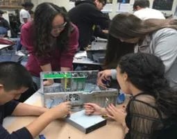 Students take apart a computer