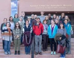 A group of people on the steps of the National Center for Atmospheric Research.