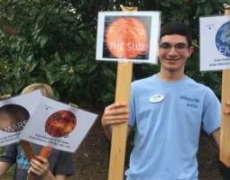 Young participants holding signs at Catawba Science Center