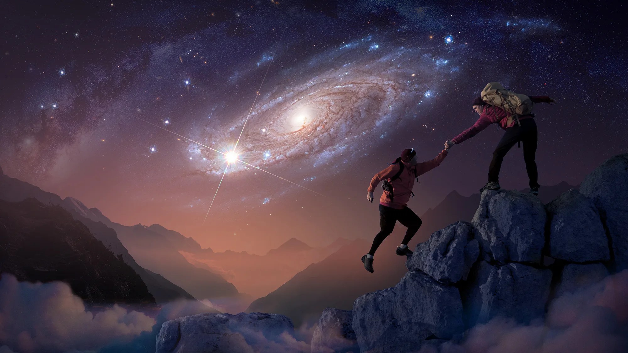 artist concept of two silhouetted people climbing a mountain with a starry sky and galaxy in the background
