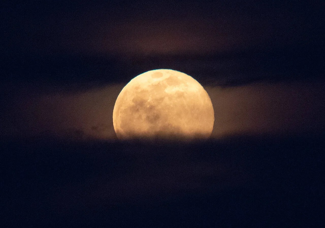 A supermoon rises behind the U.S. Capitol, Monday, March 9, 2020