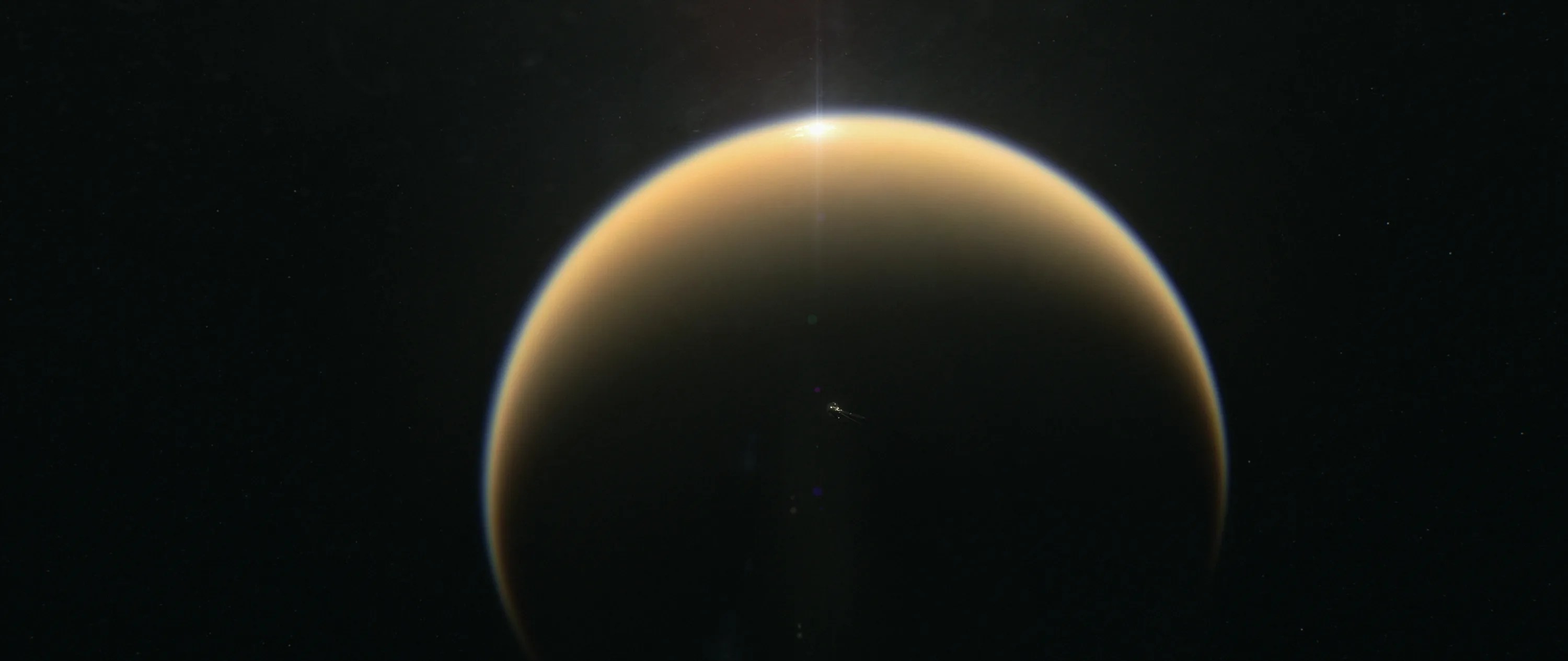 Illustration showings sunlight glint off the lakes of Titan.