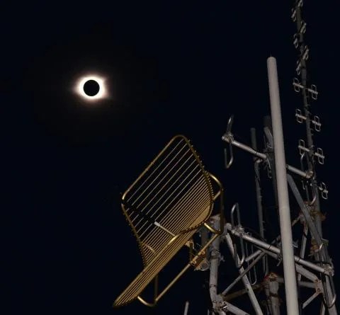 Photo of a large metal antenna with a solar eclipse in the sky