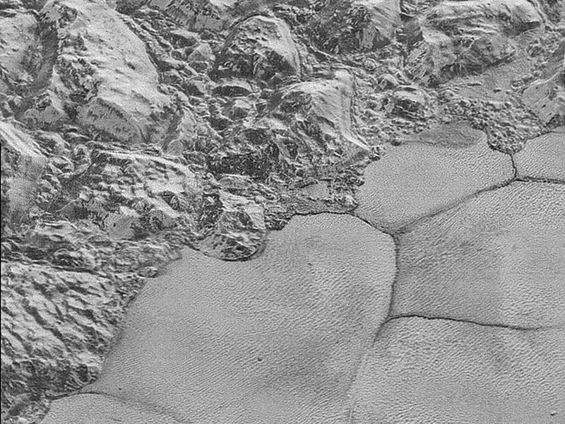 Close up of mountains and plains on Pluto.