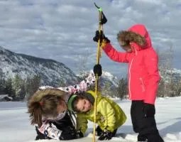 Photo of people taking snow measurements