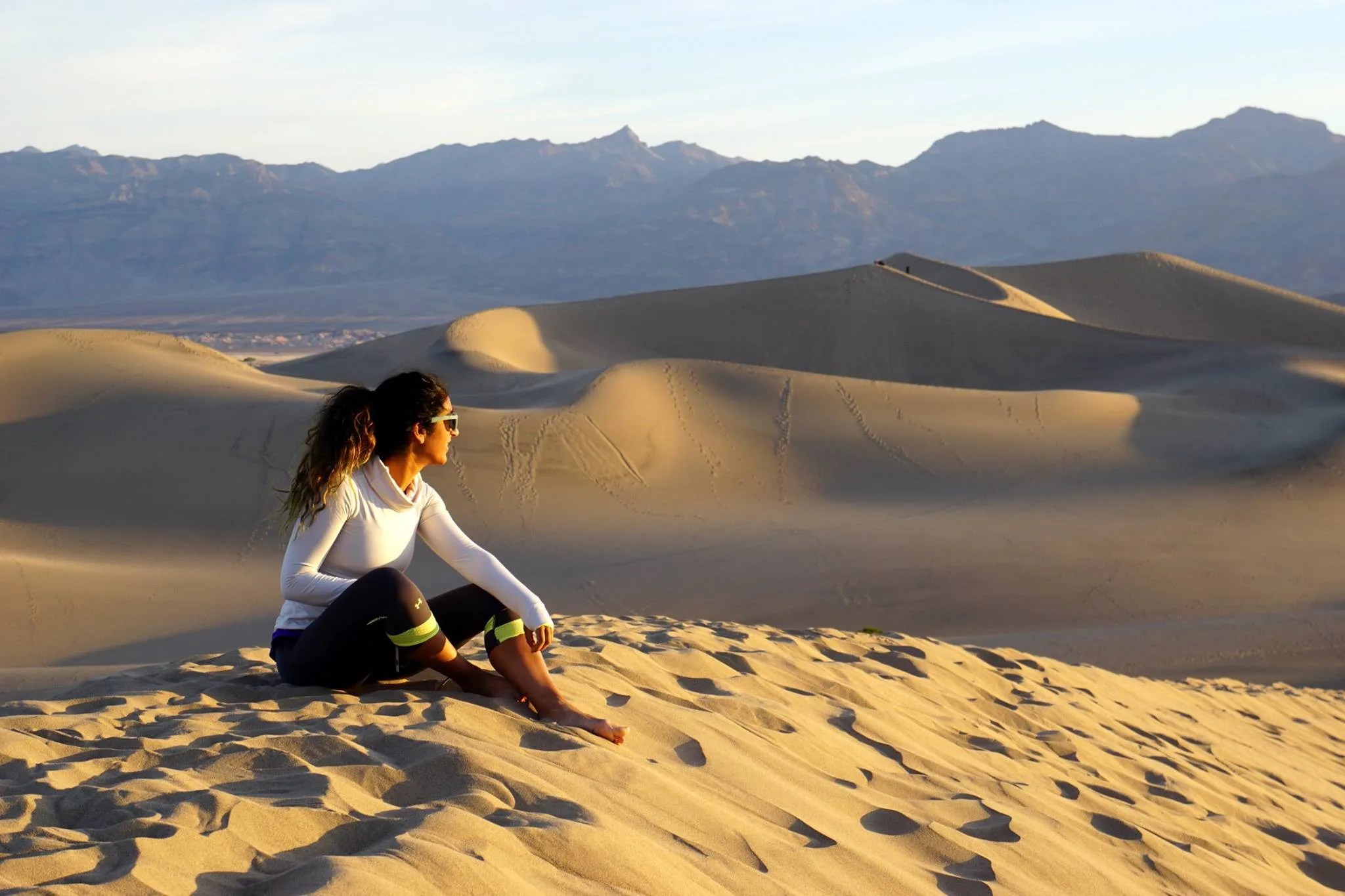 Woman on sand dunes.