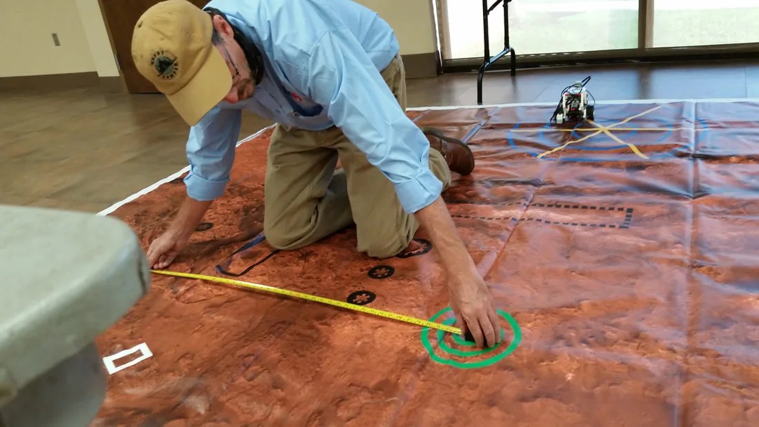 A member of the NASA ACCP Partner team at Prentiss Highschool prepares for the Rover Observation And Drone Survey (ROADS) challenges, demonstrating the resources ACCP offers to collaborating community partners.