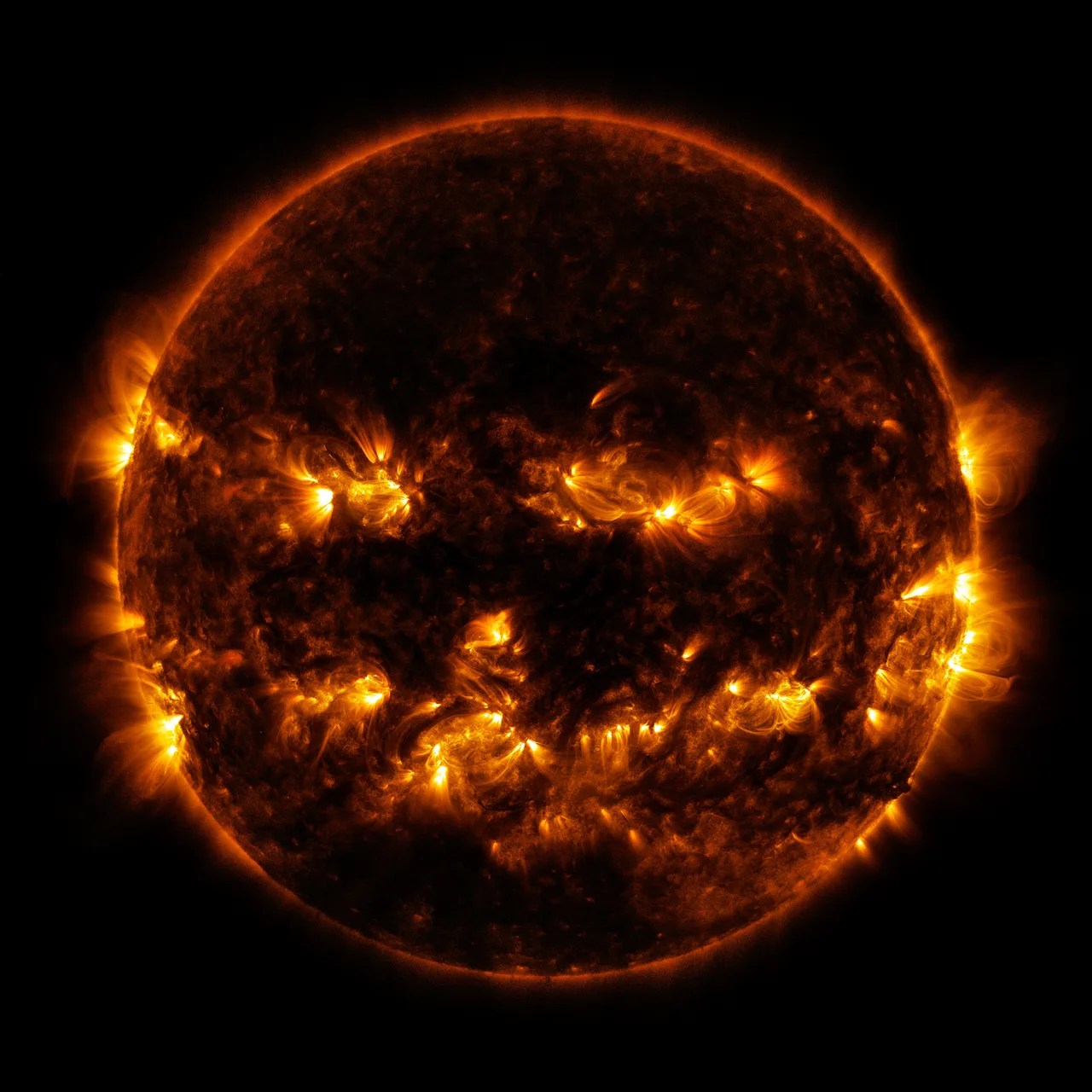 Eruptions on the Sun resemble a grinning Halloween pumpkin