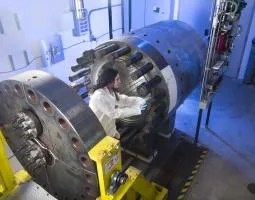 This image shows an individual working inside the Glenn Extreme Environment Rig (GEER) test chamber which is a high-tech pressure vessel that is capable of simulating extreme temperatures, pressures, and atmospheric conditions.