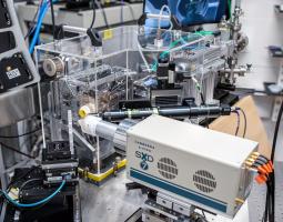 This image shows an upstream view of the 13 IDE microprobe setup showing the 7-element silicon drift detector/x-ray fluorescence detector, sample stages and mount, optical microscope, KB-Mirror focusing enclosure, and ion chamber and filter box.