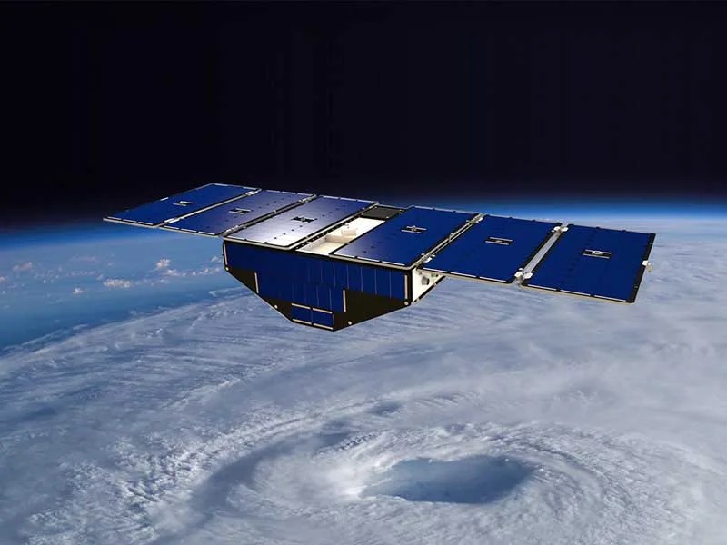 Illustration of Spacecraft in orbit about hurricane.