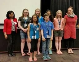 Elena Sparrow poses with Joanna Greene and her six students