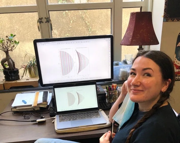 JHU graduate student Mackenzie Carlson works on translating the FORTIS aberration-correcting groove shapes into parameters the PSU e-beam tool can interpret.