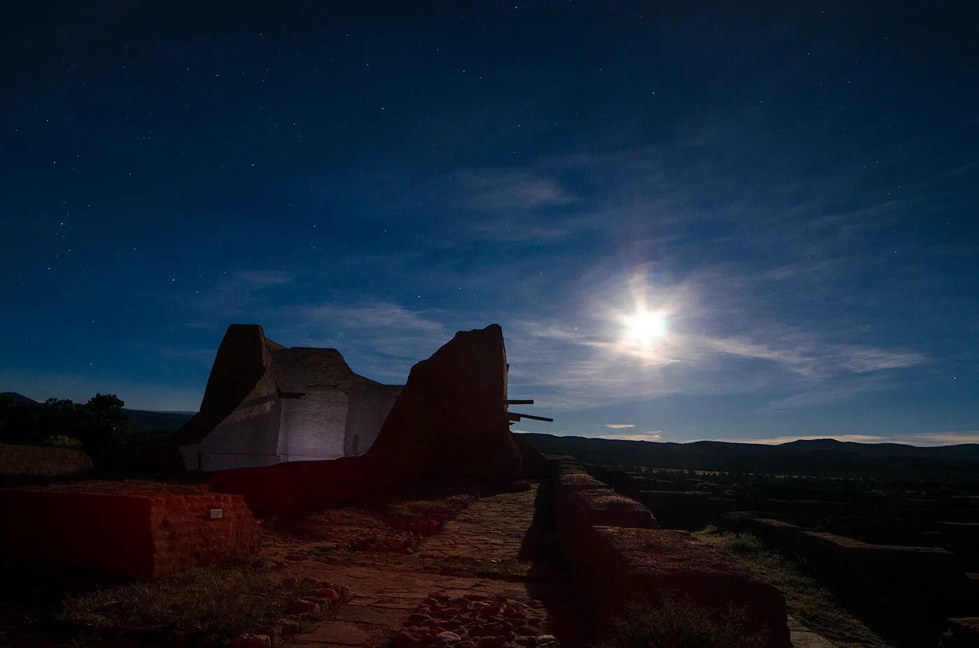 A bright Moon lights up the ruins of an old Spanish mission in New Mexico.