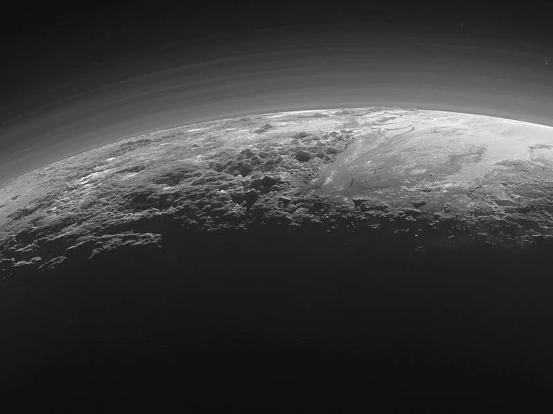 Mountains and haze over the limb of Pluto.