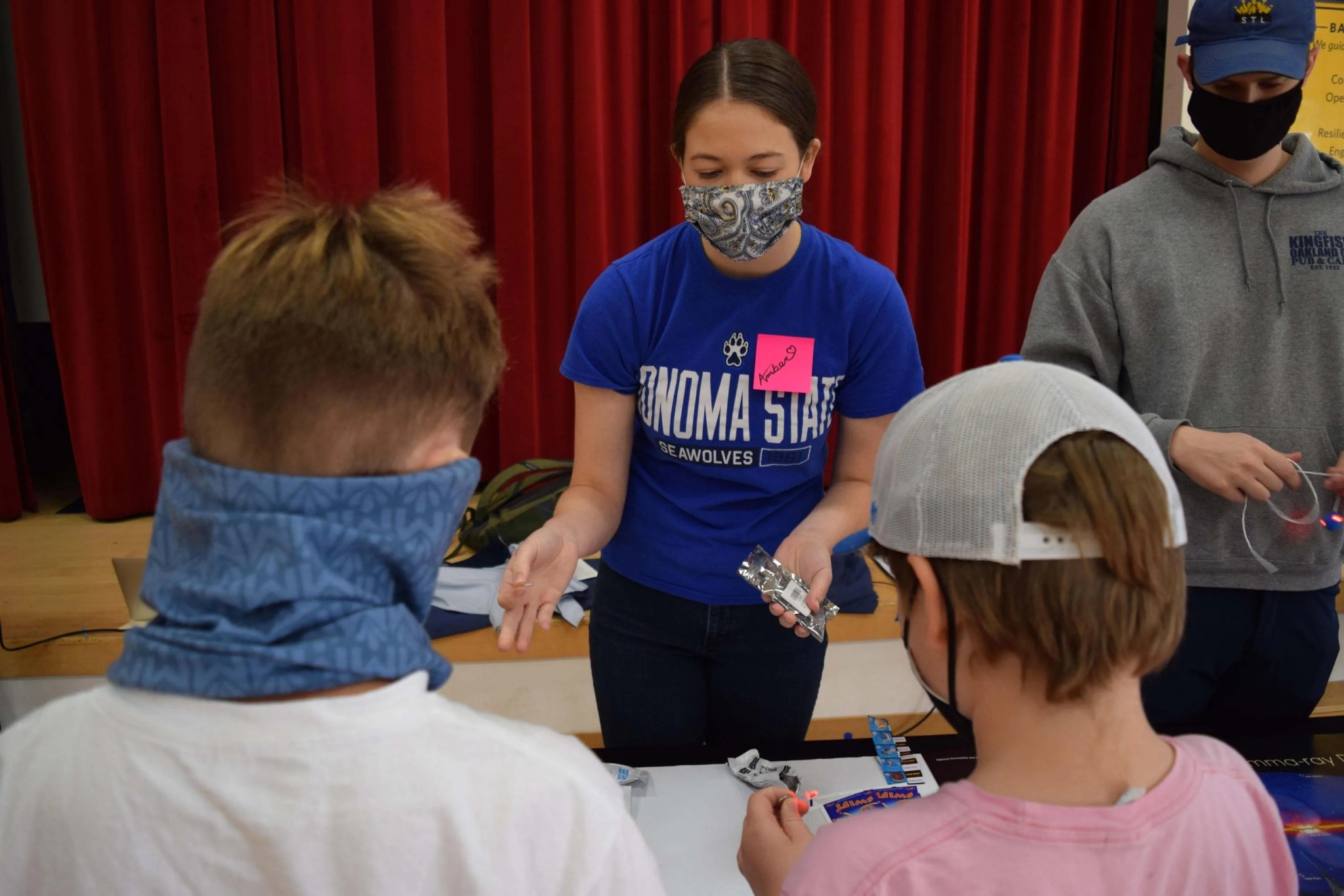 Photo of two Marin students finishing their pulsar models.