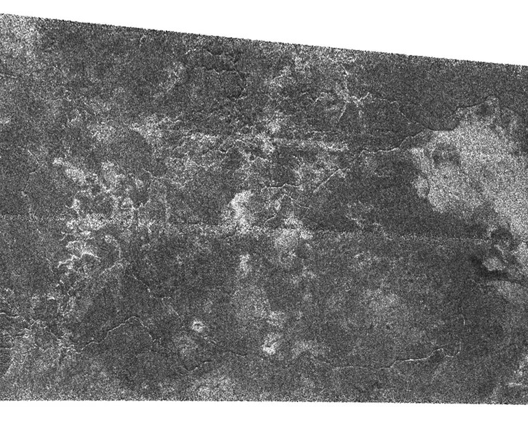 Fluids have flowed and cut these deeply-incised channels into the icy surface of Titan as seen in this Synthetic Aperture Radar image. This Cassini radar image was acquired as a part of the Titan flyby observations taken on Sept. 7, 2005, from a distance of about 2,000 kilometers (1,250 miles).