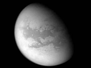 This processed image from Cassini's Aug. 22, 2005, flyby of Titan reveals mid-latitudes on the moon's Saturn-facing side.