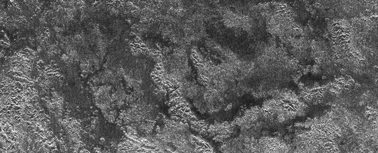 The Cassini spacecraft's Titan Radar Mapper instrument imaged this area atop Xanadu, the bright area of Titan, on April 30, 2006. The darkest areas could contain liquids, which tend to reflect the radar beam away from Cassini in the absence of winds, making the area appear quite dark.