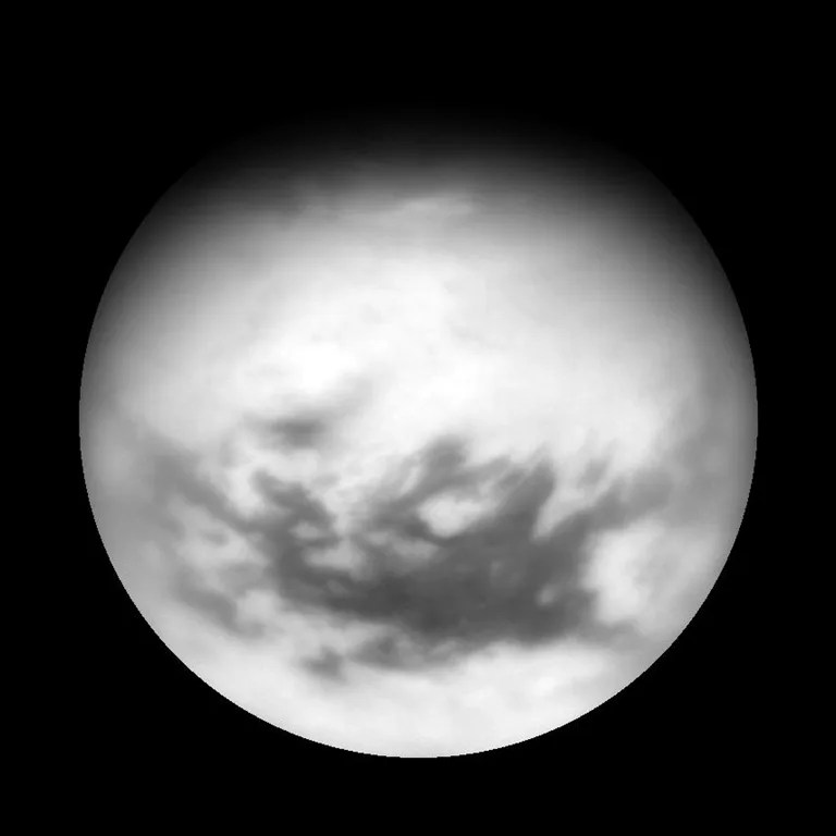 Titan's equatorial dark regions are visible in this view, along with faint, dark lineaments (linear features) in the otherwise bland-looking terrain of the north. Image taken April 13, 2007.