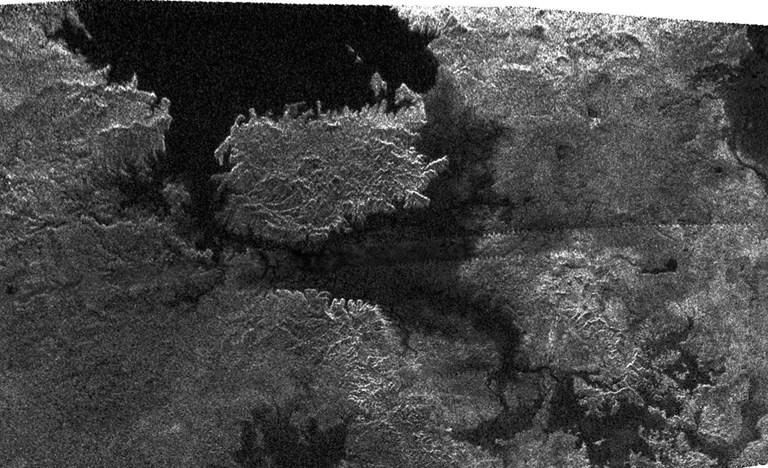 This radar image, obtained by Cassini's radar instrument during a near-polar flyby on Feb. 22, 2007, shows a big island smack in the middle of one of the larger lakes imaged on Saturn's moon Titan.