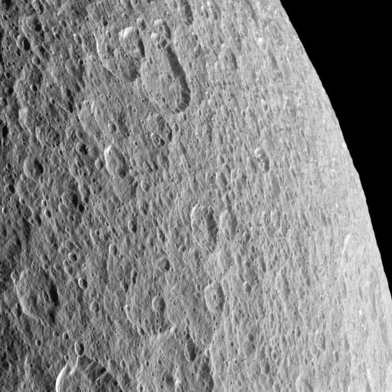 Craters imprinted upon other craters record the long history of impacts endured by Saturn's moon Rhea. The image was taken in visible light with the Cassini spacecraft narrow-angle camera on Oct. 13, 2009.