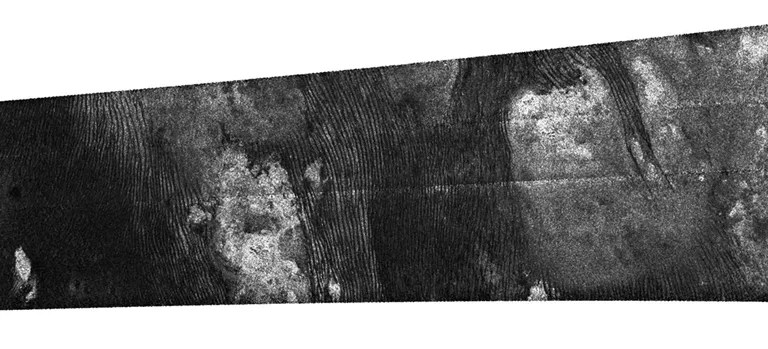 An intricate, fingerprint-like pattern of dunes is seen in this dramatic radar image of Saturn's moon Titan captured by NASA's Cassini spacecraft on May 21, 2009.