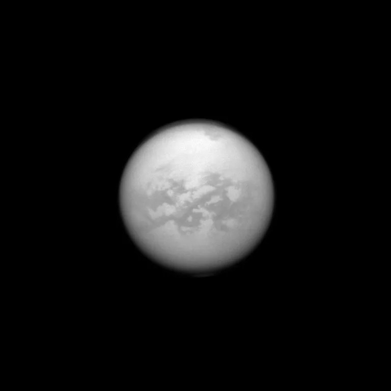 The Cassini spacecraft once again dons its special infrared glasses to peer through Titan's haze and monitor its surface. Here, Cassini has recaptured the equatorial region dubbed 'Senkyo.' The dark features are believed to be vast dunes of hydrocarbon particles that precipitated out of Titan's atmosphere. Image released Oct. 28, 2013.