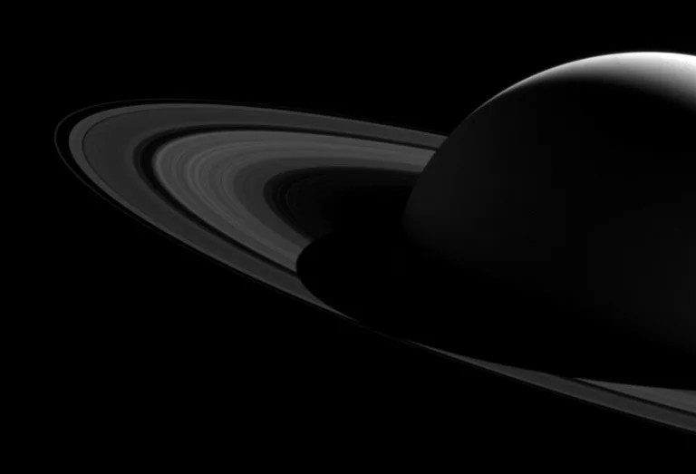 A black and white image of Saturn and its magnificent rings