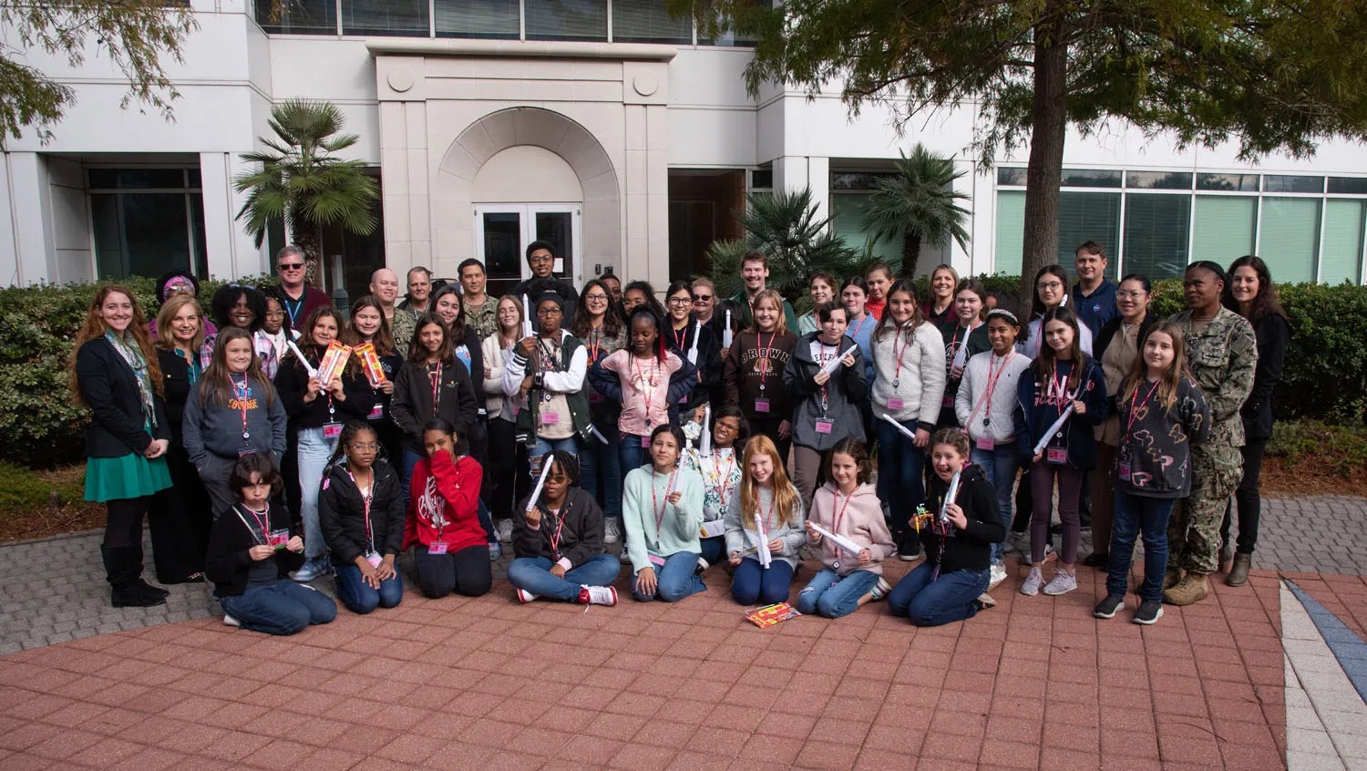 In this image, the NOLA Girls' Day Out group poses together with NASA ACCP team members for a group photo after the rocket launches conclude at the Navy Information Warfare Center in New Orleans on Nov. 21 during the NOLA Girls' Day Out Event.