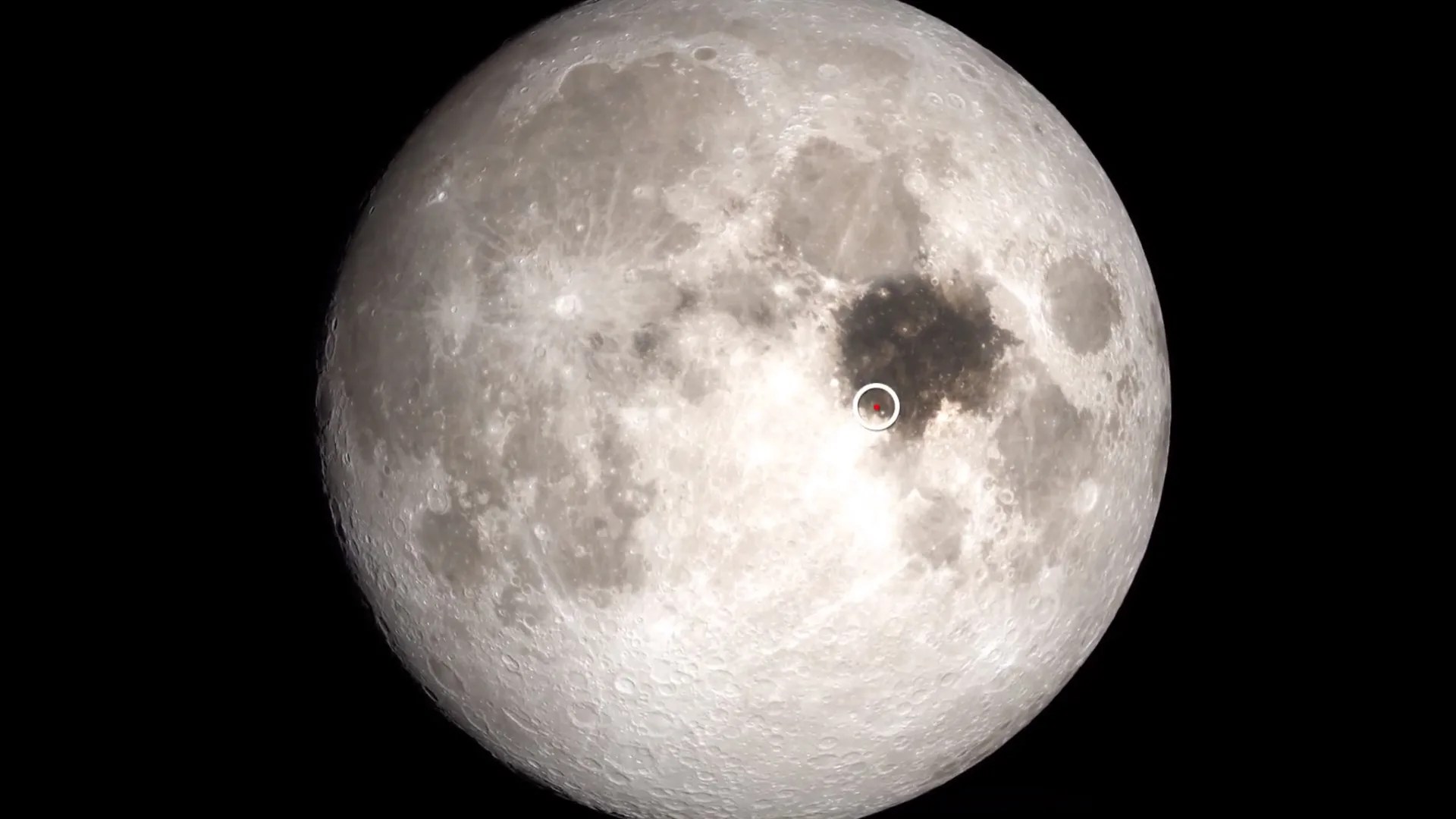 Picture of Moon with Sea of Tranquility and Apollo 11 landing site marked.